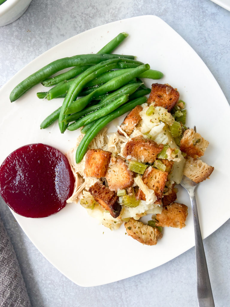 Friendsgiving casserole with green beans and cranberry sauce